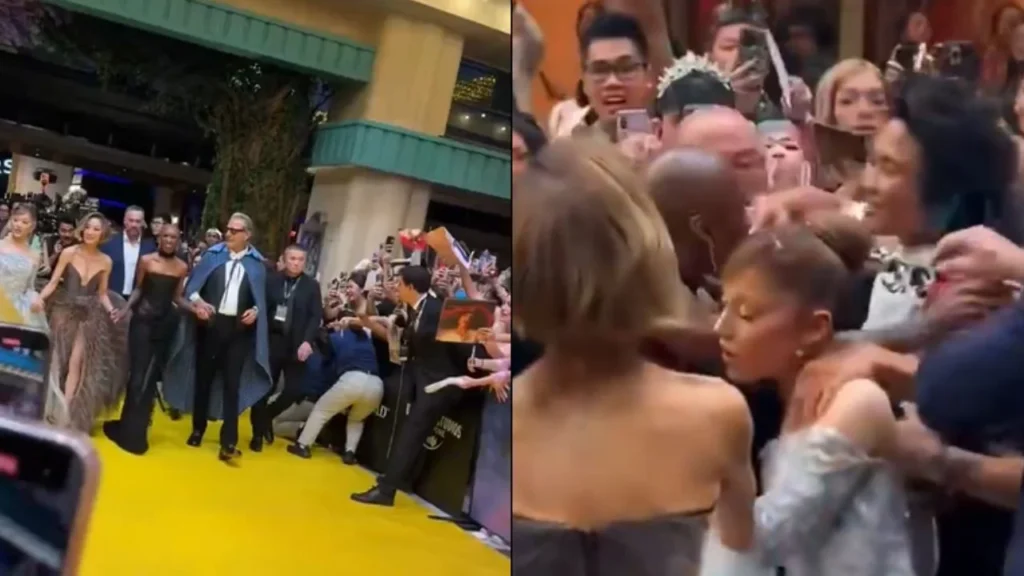 Ariana Grande durante la gala de estreno de “Wicked: For Good” en Singapur, vive incómodo momento luego de que un fan se saltará las vallas de protección, para agarrar de manera efusiva a la artista,
