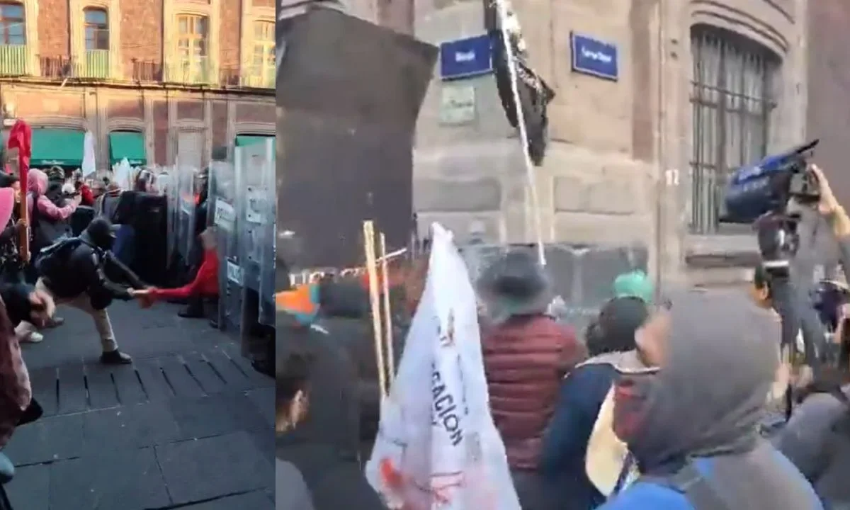 Presuntos miembros de la CNTE intentan derribar vallas en Palacio Nacional